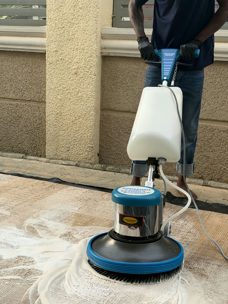 A closeup of carpet cleaning in process